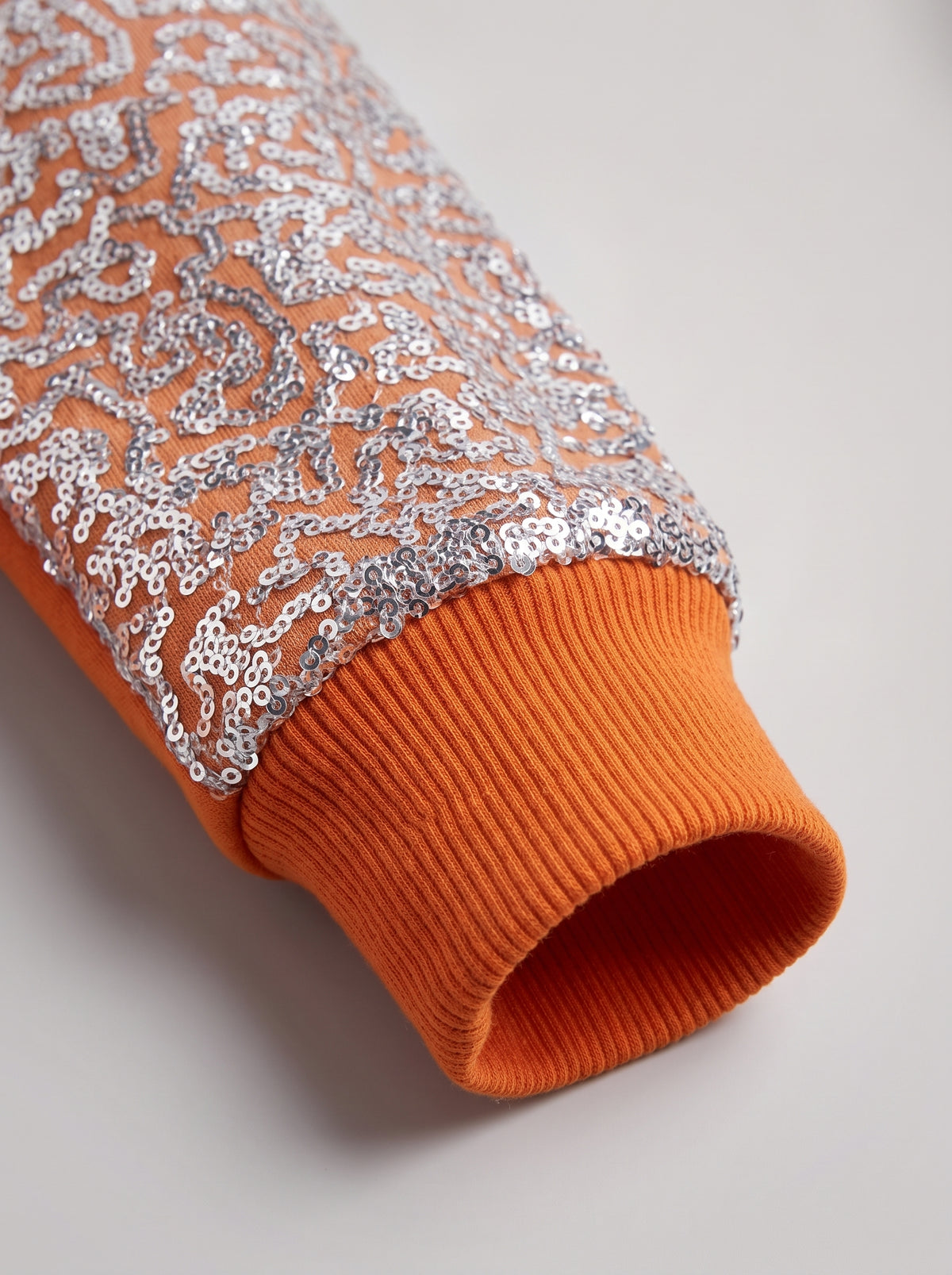 Color-Block Orange Jumper with Glam Sequin Sleeve